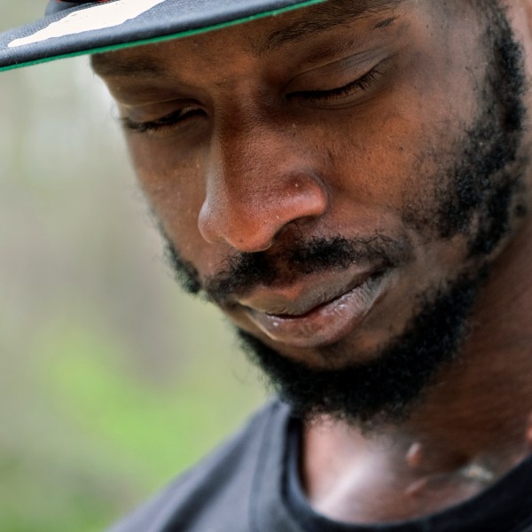 FILE - Michael Corey Jenkins stands outside Taylor Hill Church in Braxton, Miss., March 18, 2023. Six former Mississippi law officers, including some who call themselves the "Goon Squad,” will plead guilty to state charges Monday, Aug. 14, for their racist assault on two Black men, including Jenkins, that ended with an officer shooting one man in the mouth. (AP Photo/HG Biggs, File)